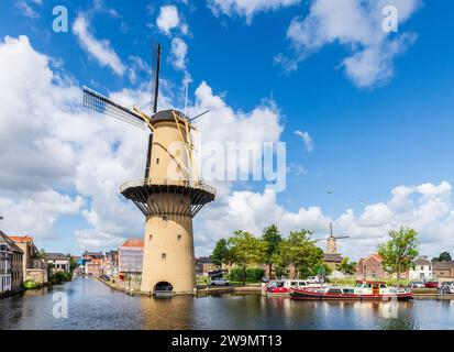 The Schiedam windmills near Rotterdam, Netherlands, are the tallest classic windmills in the world, with the Kameel and the Palmboom windmills. Stock Photo