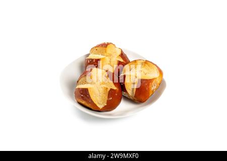 Three Laugen Pretzel Rolls on White Plate - Traditional German Bakery Snack Stock Photo