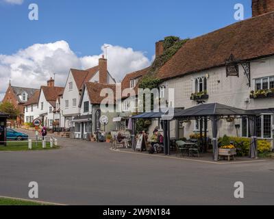 Street scene in the pretty village of Finchingfield, Essex, UK; with the 16th century Fox Inn to the right. Stock Photo