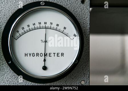 hygrometer manometer humidity measurement on a industrial metal wall. Stock Photo