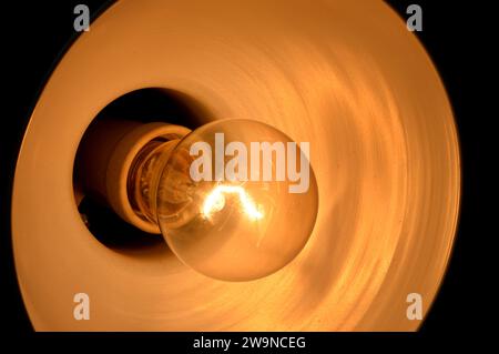 incandescent light globe bulb lamp, an electric light with a wire filament tungsten that is heated until it glows, consists of gas bulb, low pressure Stock Photo