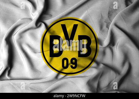 Selective focus of Borussia Dortmund logo. Football club in Dortmund, North Rhine-Westphalia. with a flowing fabric texture. 3D illustration Stock Photo