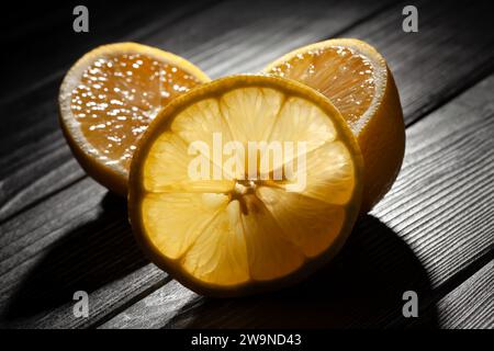 sliced lemon on wood background Stock Photo
