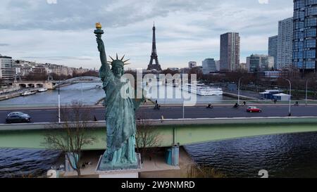 Aerial drone view of Statue of Liberty (Statue de la Liberté replica on Île aux Cygnes in Paris, Île-de-France, France. Bronze monument on Seine. Stock Photo
