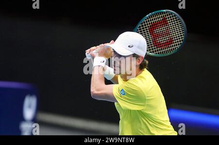 Perth, Australia. 29th Dec, 2023. Alex de Minaur of Australia hits a return to Cameron Norrie of Britain during the men's singles match at the United Cup tennis tournament in Perth, Australia, Dec. 29, 2023. Credit: Zhou Dan/Xinhua/Alamy Live News Stock Photo