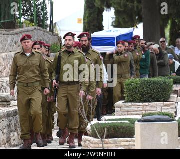 Jerusalem, Israel. 29th Dec, 2023. Israeli soldiers carry the flag-draped casket of Captain (reserve) soldier Harel Sharvit, 33, during his funeral at the Mt. Herzl military cemetery in Jerusalem, on Friday, December 29, 2023. Sharvit, from the Kochav Ya'acov Settlement, was killed in combat in northern Gaza by Palestinian militants. The number of IDF casualties on the ground since the invasion of Gaza after the October 7 Hamas massacre stands at 168. Photo by Debbie Hill/ Credit: UPI/Alamy Live News Stock Photo