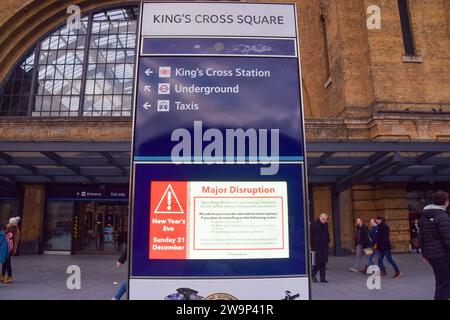 London, UK. 29th December 2023. A sign at King's Cross station warns of major travel disruptions on New Year's Eve. Credit: Vuk Valcic/Alamy Live News Stock Photo