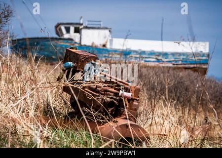 Abandoned wooden fishing boat slowly rotting away on the Eastern Shore of Nova Scotia, Canada. Stock Photo