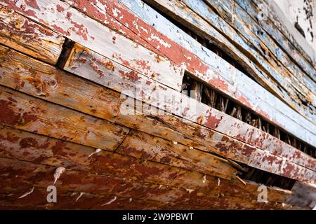 Abandoned wooden fishing boat slowly rotting away on the Eastern Shore of Nova Scotia, Canada. Stock Photo