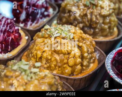 Small cake garnished with walnuts Stock Photo