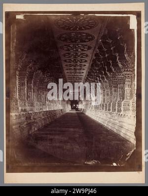 Colonnade in the Ramanathaswamy temple in Rameswaram, Tamil Nadu, India, 1870 - 1890 photograph This column is one of the longest temple corridors in India. He is part of the Hindu Ramanathaswamy temple in Rameswaram, in the state of Tamil Nadu. The temple is one of the twelve Jyotirlinga Shiva temples. According to the Ramayana, Rama prayed here to the God Shiva for blessing of Ravana, the king of Lanka. The temple is famous for the long corridors, which are the longest in the world. Rameswaram baryta paper  temple, shrine  Hinduism, Buddhism, Jainism. corridor Rameswaram Stock Photo