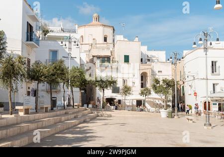 Polignano a Mare, Puglia, Italy - October 4, 2023: The square with bars and restaurants in the center of the Polignano a Mare village, in province of Stock Photo