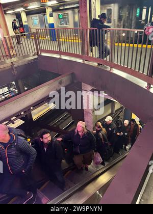 Subway riders transfer at the Broadway Lafayette station from the F ...