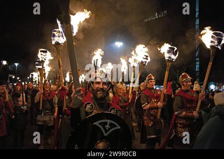 Edinburgh's Hogmanay celebrations begin with the Torchlight Procession. 29th December 2023. Return to the for the first time since 2019, it will see thousands take to the streets to light a trail through the city. The procession will snake its way from The Meadows through the Old Town to the Castle. Around 20,000 people will blaze a trail through the capital, creating a river of fire through the city, organisers aim to raise over £50,000 throughout the festival to to fund Social Bite. Pictured: Vikings from Shetland’s South Mainland Up Helly Aa’ Jarl Squad  Credit: Archwhite/alamy live news Stock Photo