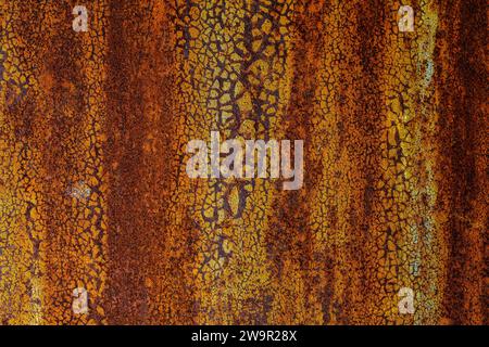Old rusty metal door, painted blue which becomes orange from rust. Texture of cracks and peels paint. Stock Photo