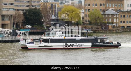 London, UK - March 18 2023; Neptune Clipper Uber Boat by Thames Clippers at Tower Bridge Quay Stock Photo