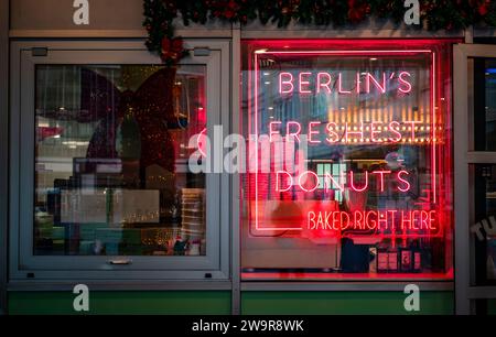 Shop window red neon lights of the Doughnut Time donut bakery at Alexanderplatz, Berlin Mitte, Germany, Europe Stock Photo