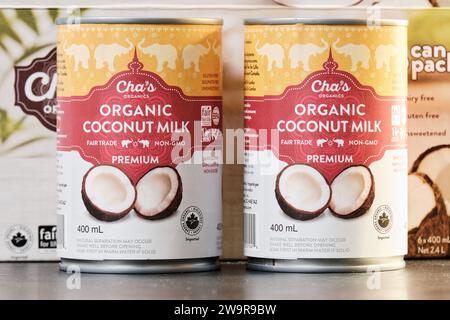 Cans of Cha's Organic Coconut Milk Premium imported from Sri Lanka Stock Photo