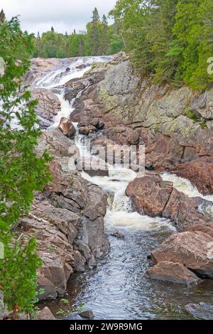 Vibrant Cascade Cutting Through a Rocky Channel on the Sand River in Superior Provincial  Park in Ontario Stock Photo