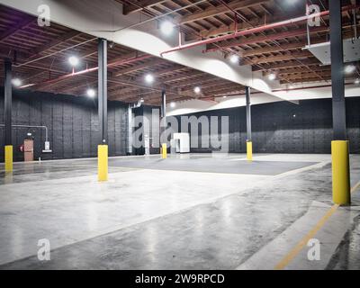 Interior of sound stage for shooting video in Seattle, Washington. Large interior industrial warehouse, retro-fitted, with sound--treated walls. Stock Photo