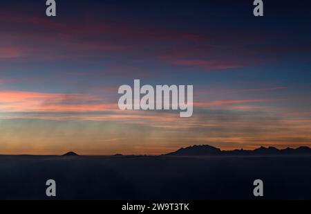 The Monte Rosa massif in silhouette at sunset Stock Photo