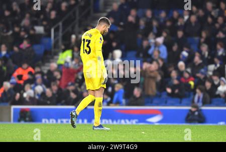 Guglielmo Vicario of Spurs looks dejected during the Premier League match between Brighton and Hove Albion and Tottenham Hotspur at the American Express Stadium  , Brighton , UK - 28th December 2023. Photo Simon Dack / Telephoto Images  Editorial use only. No merchandising. For Football images FA and Premier League restrictions apply inc. no internet/mobile usage without FAPL license - for details contact Football Dataco Stock Photo