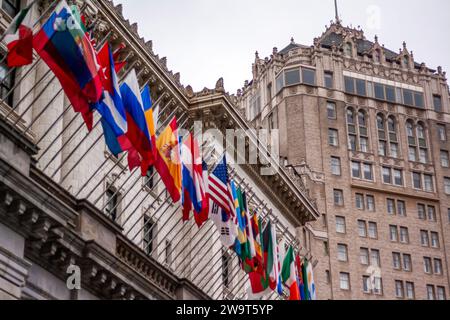 World flags of many nations flying outside the luxury Fairmont Hotel, San Francisco, California, with the Intercontinental Mark Hopkins in background Stock Photo