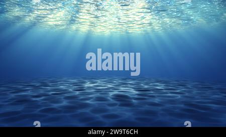 Majestic Underwater scene of deep blue water sea, Underwater sandy seafloor and reflected rays of sunlight below water surface. ocean, sea life. Stock Photo