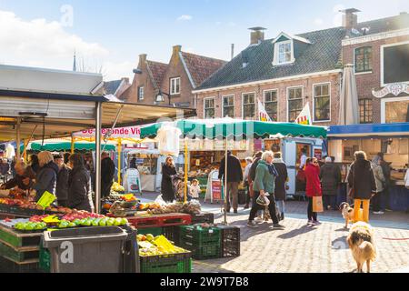 Busy and cozy market on the church square in the center of the city of Meppel. Stock Photo