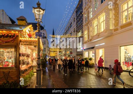 Bonn, Germany - December 21, 2023 : People walking around the traditional  and picturesque Christmas Market in Bonn Germany Stock Photo