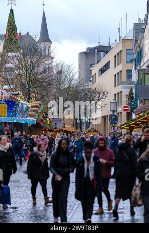 Bonn, Germany - December 21, 2023 : People walking around the traditional  and picturesque Christmas Market in Bonn Germany Stock Photo