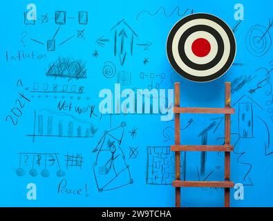 Stand out from the crowd and think different, creativity,vision, idea business concept. Ladder of success, goal target and scribble on blue background Stock Photo