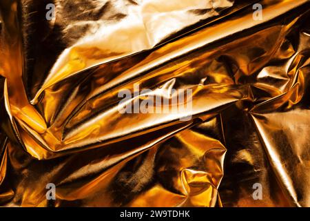 crumpled gold metallic reflector background texture Stock Photo