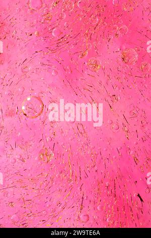 Photo of oil on a water surface with bubbles. soft pink. Abstract colorful background. Macro close-up, not illustration. Stock Photo