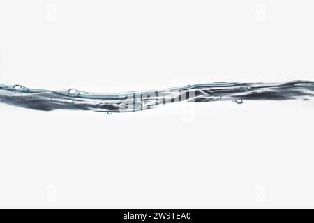 Water surface background with waves and air bubbles on white background from side view. Stock Photo