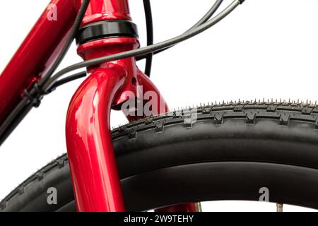 Close-up front part of a red shiny bike with a rigid fork on a white background Stock Photo