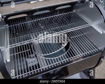 Fragment of a metal brazier with a grill grate Stock Photo