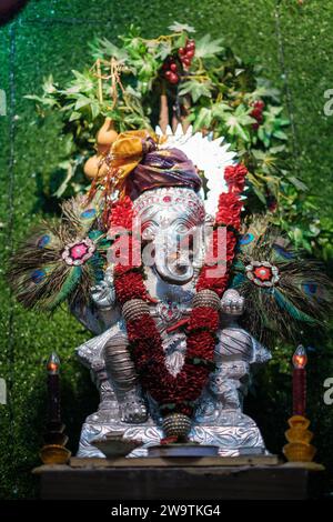 Silver Ganesha Structure with Decorative Accessories Stock Photo