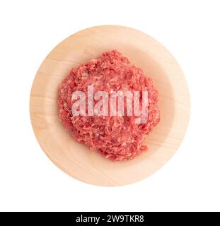raw beef mince in wooden plate isolated on white background with clipping path, minced meat of pork or chiken top view, ready to cook lasagna or meatb Stock Photo