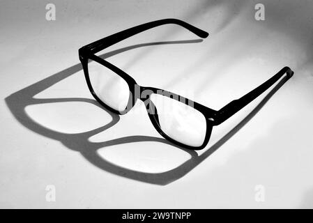 Den Helder, Netherlands. November 2023. A pair of glasses with shadow on white background. High quality photo Stock Photo