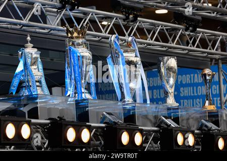 Manchester, UK. 30th Dec, 2023. City display their five trophies ahead of the Premier League match Manchester City vs Sheffield United at Etihad Stadium, Manchester, United Kingdom, 30th December 2023 (Photo by Conor Molloy/News Images) in Manchester, United Kingdom on 12/30/2023. (Photo by Conor Molloy/News Images/Sipa USA) Credit: Sipa USA/Alamy Live News Stock Photo