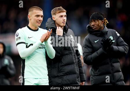 Left to right, Chelsea's Alfie Gilchrist, Cole Palmer and Noni Madueke applaud the fans after the Premier League match at Kenilworth Road, Luton. Picture date: Saturday December 30, 2023. Stock Photo