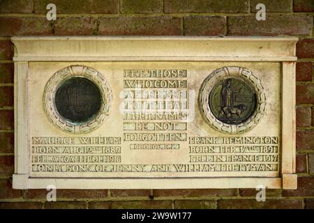 UK, England, Surrey, Compton, Watts Cemetery, cloister, Prettyman family war dead memorial plaque with ‘death pennies’ Stock Photo