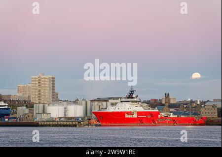 Aberdeen harbour and ship viewed during sunrise Stock Photo