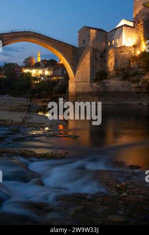 Stari Most or Mostar bridge above the Neretva river and the old town in Mostar in Bosnia and Herzegovina in Eastern Europe Stock Photo