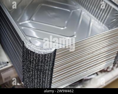 Stack of aluminum baking dishes. (Shallow depth of field) Stock Photo