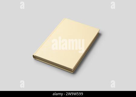 blank yellow hardcover book isolated on neutral gray background, mockup template graphic resource Stock Photo