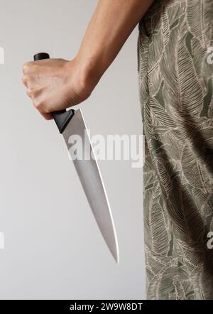 A girl holding a knife Stock Photo