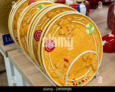 Voronezh - Russia, December 25, 2022: Souvenir plates with gingerbread men Stock Photo