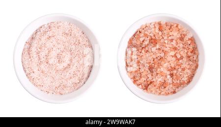 Himalaya pink salt, fine and coarse, in white bowls. Fine Himalayan salt, rock salt and halite with pinkish tint, due to trace minerals. Stock Photo